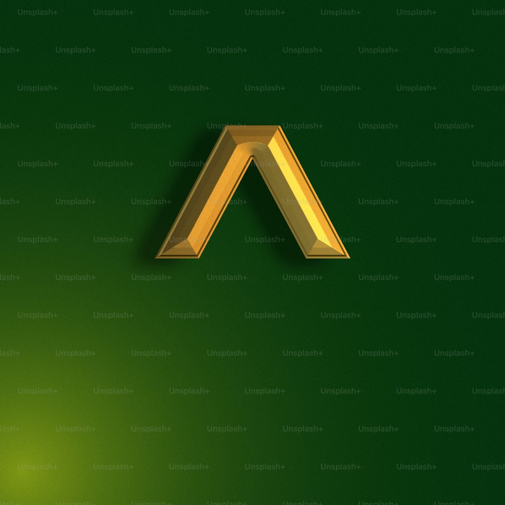 a gold letter on a green background