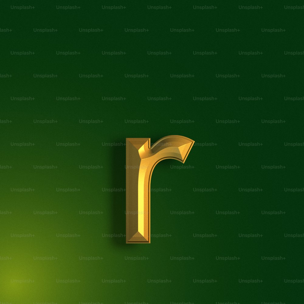 Una letra dorada sobre un fondo verde