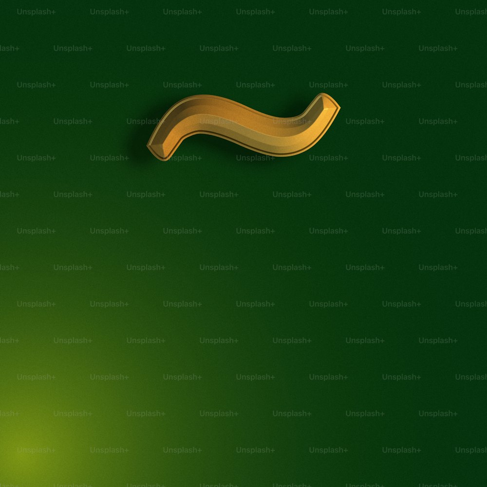 a green background with a gold curved object