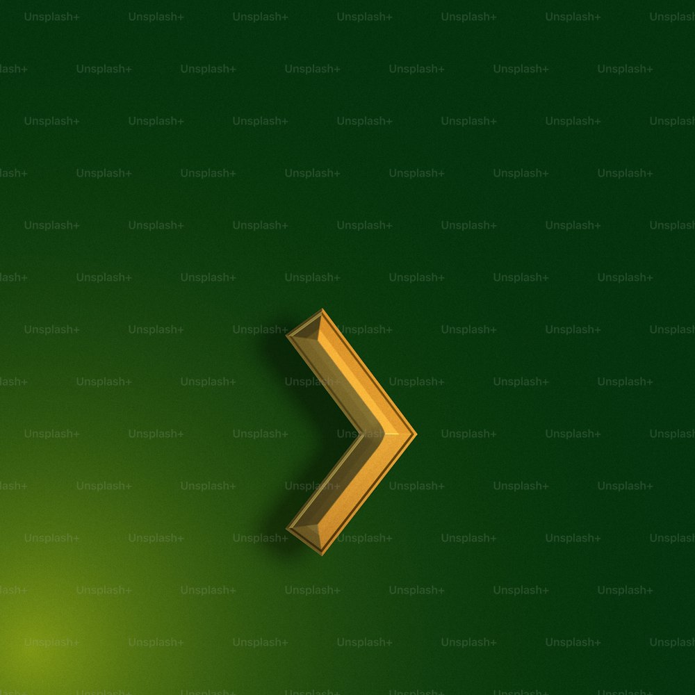 a green wall with a gold arrow on it
