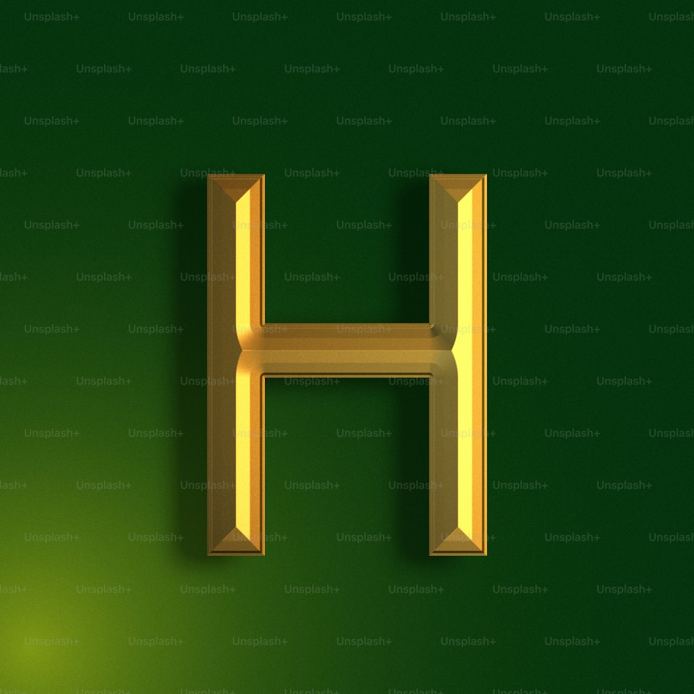 um h dourado em um fundo verde