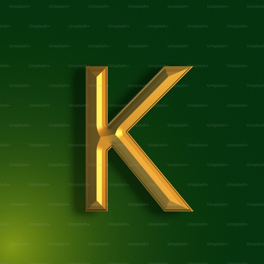 a golden letter k on a green background
