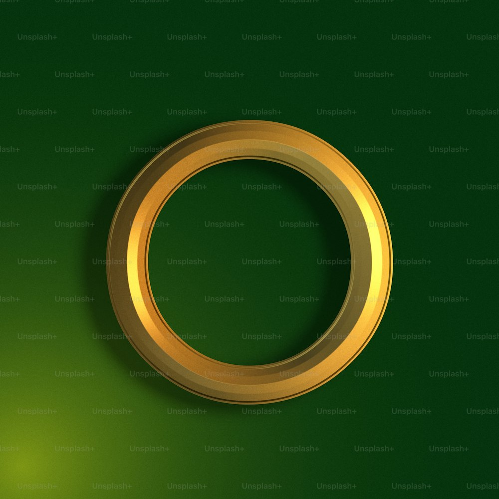 a gold ring on a green background