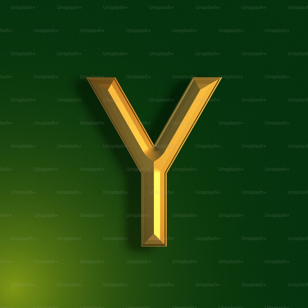 a golden letter y on a green background
