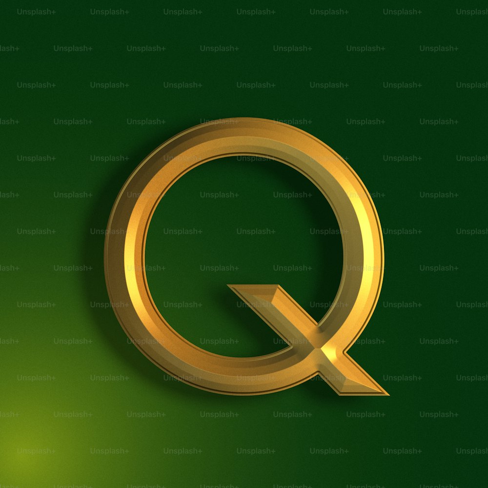 a gold letter q on a green background