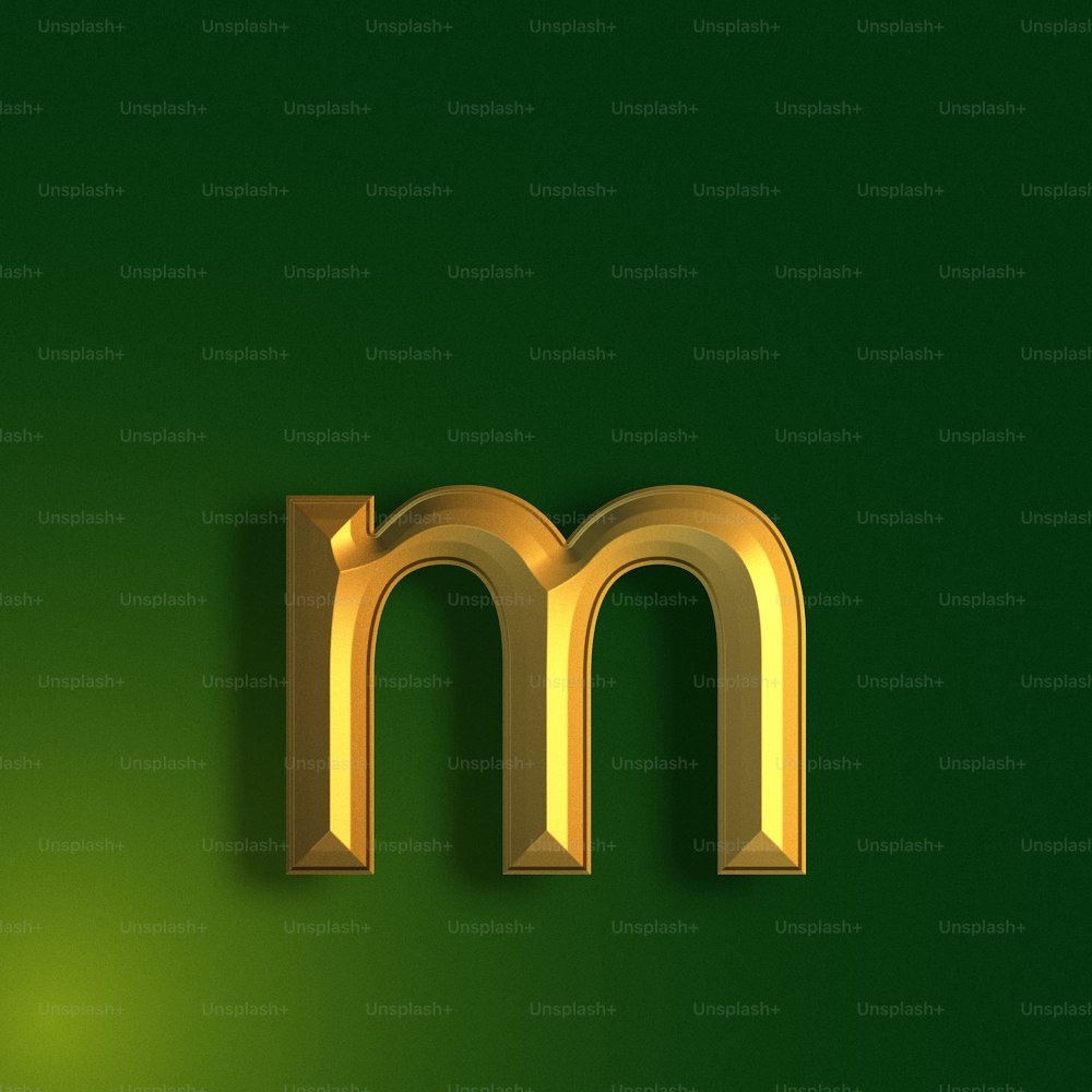 a gold letter m on a green background