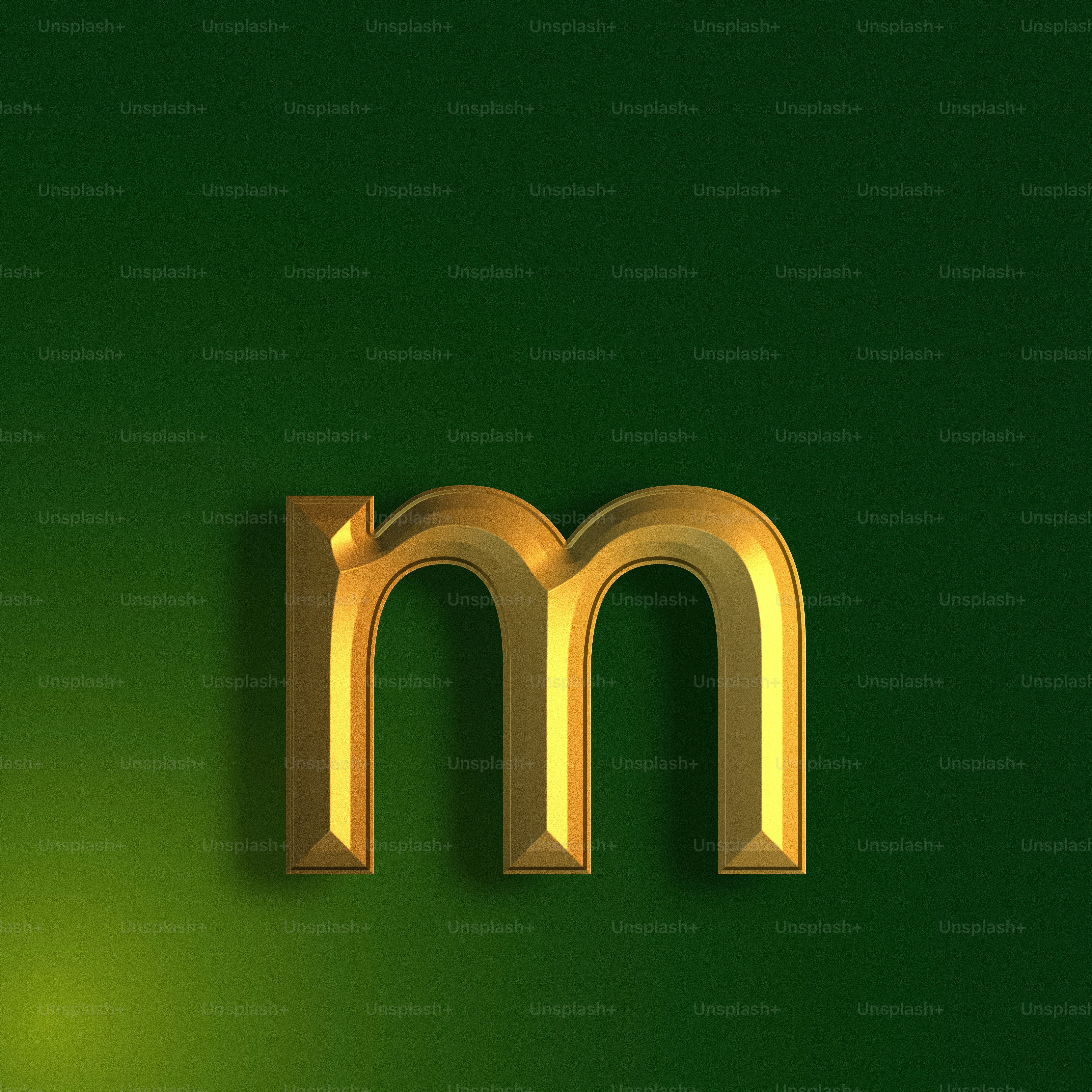 a gold letter m on a green background