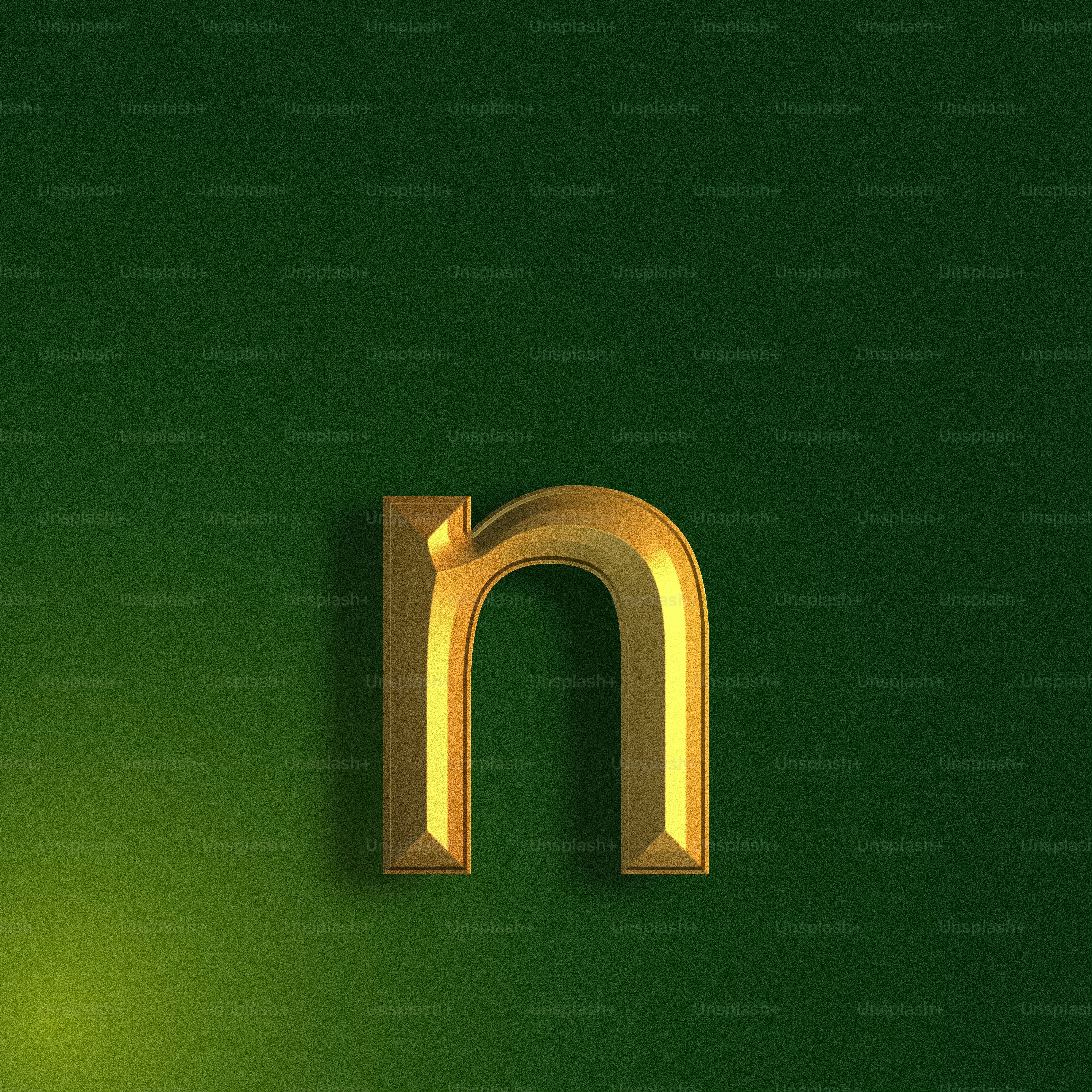 a gold letter m on a green background