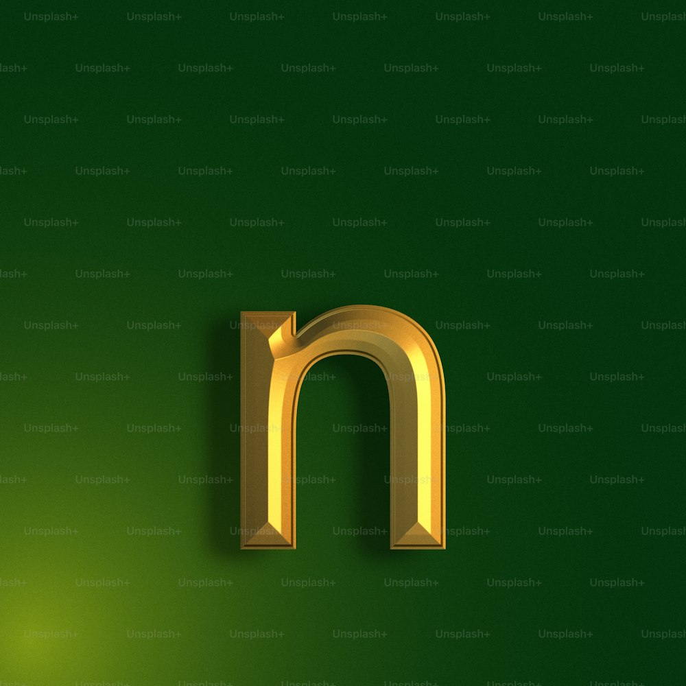 a gold letter m on a green background