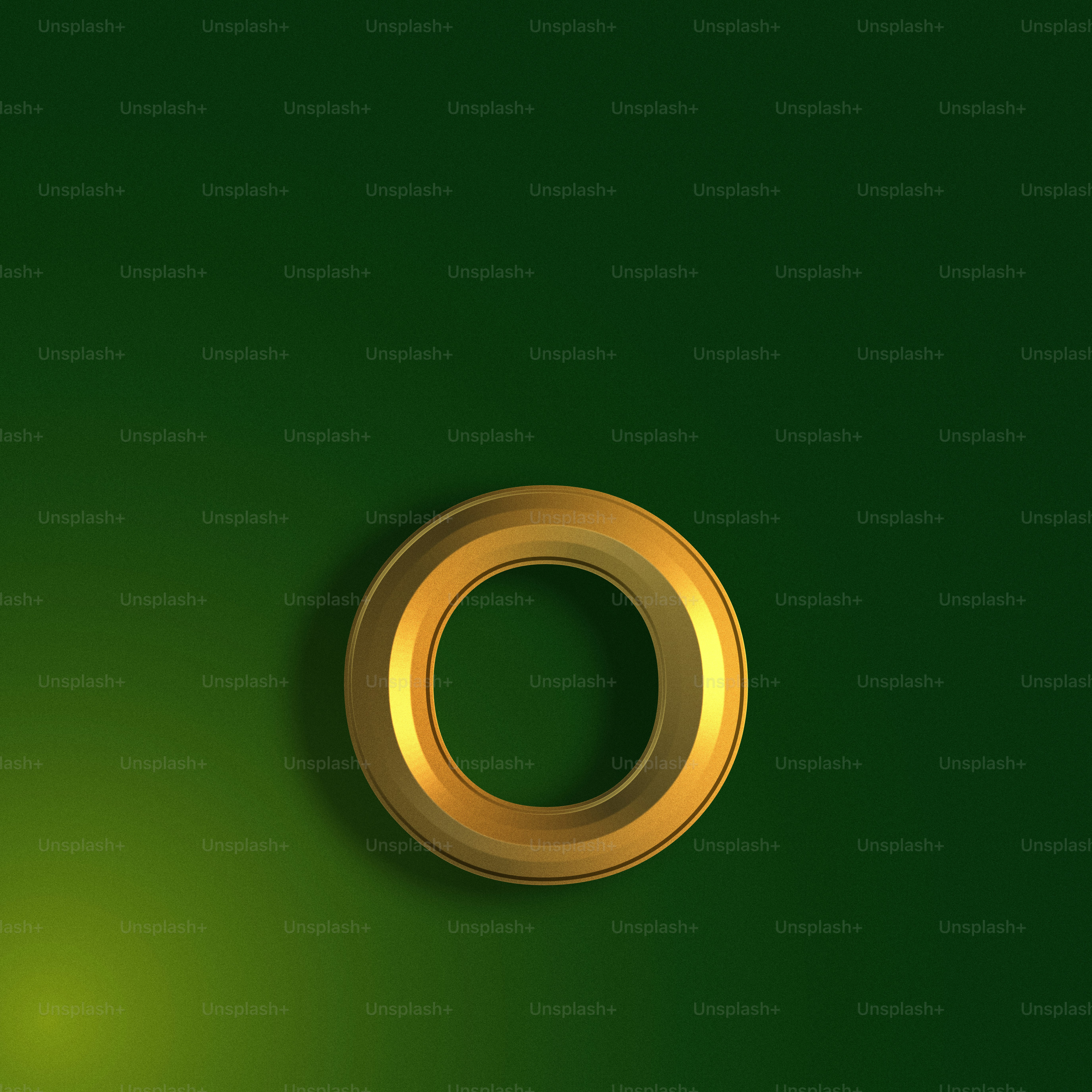 a gold ring on a green background