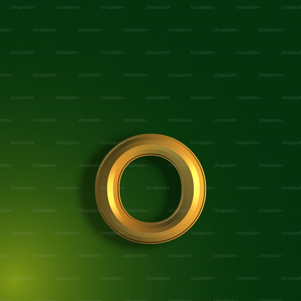 a gold ring on a green background