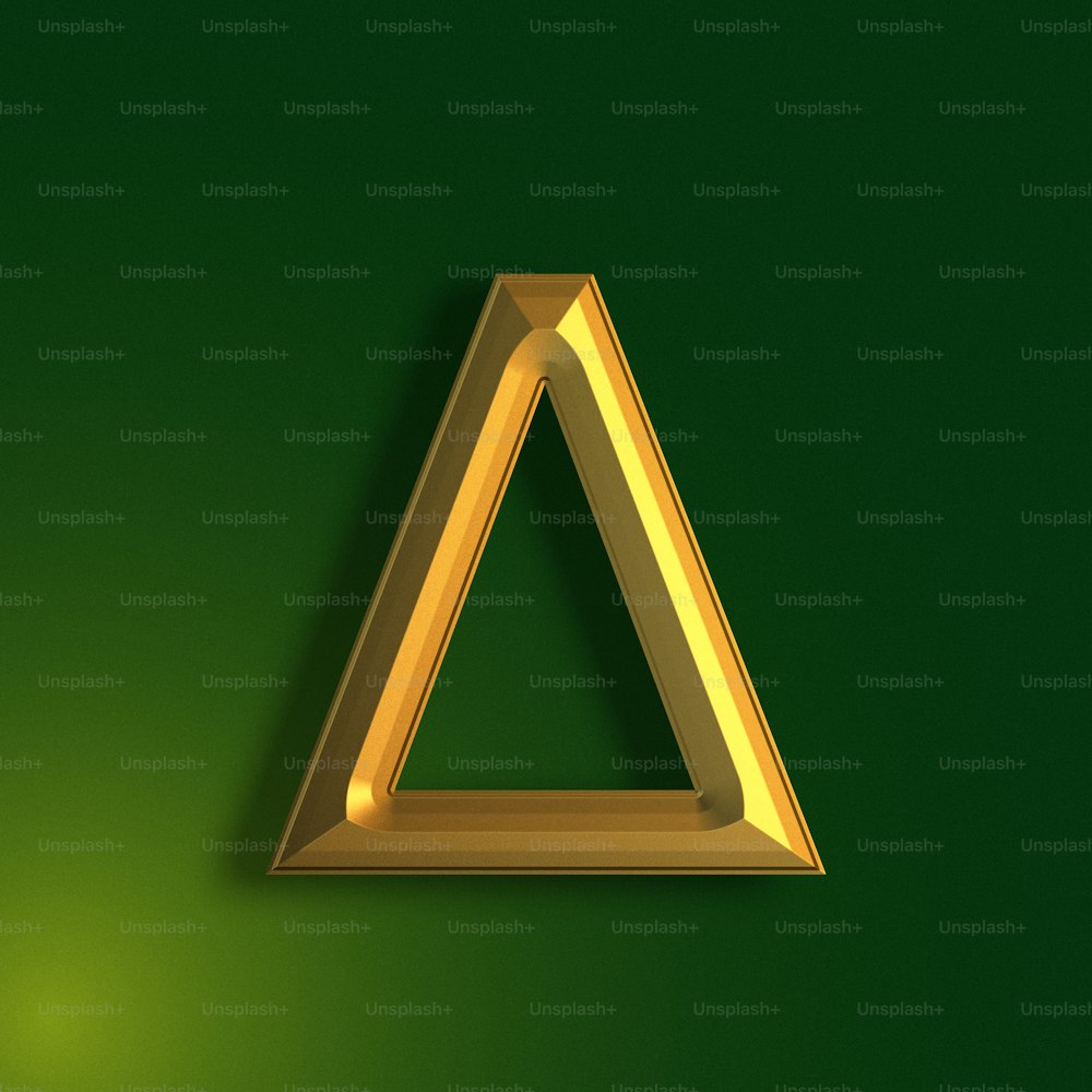 a gold triangle on a green background