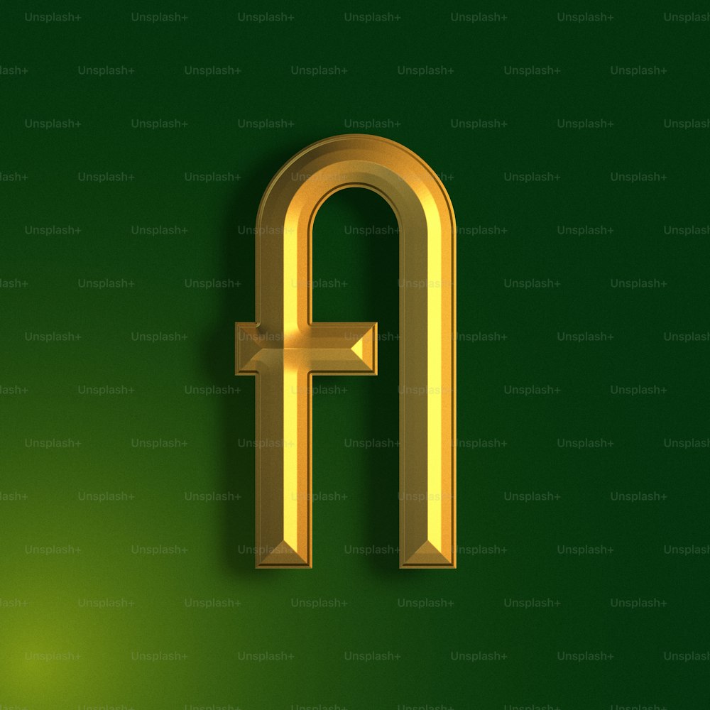 a golden letter on a green background