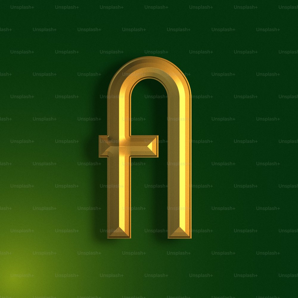 ein goldener Buchstabe auf grünem Hintergrund