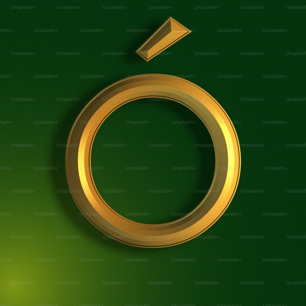 a gold ring with an arrow on a green background