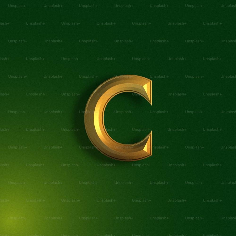 a gold letter c on a green background