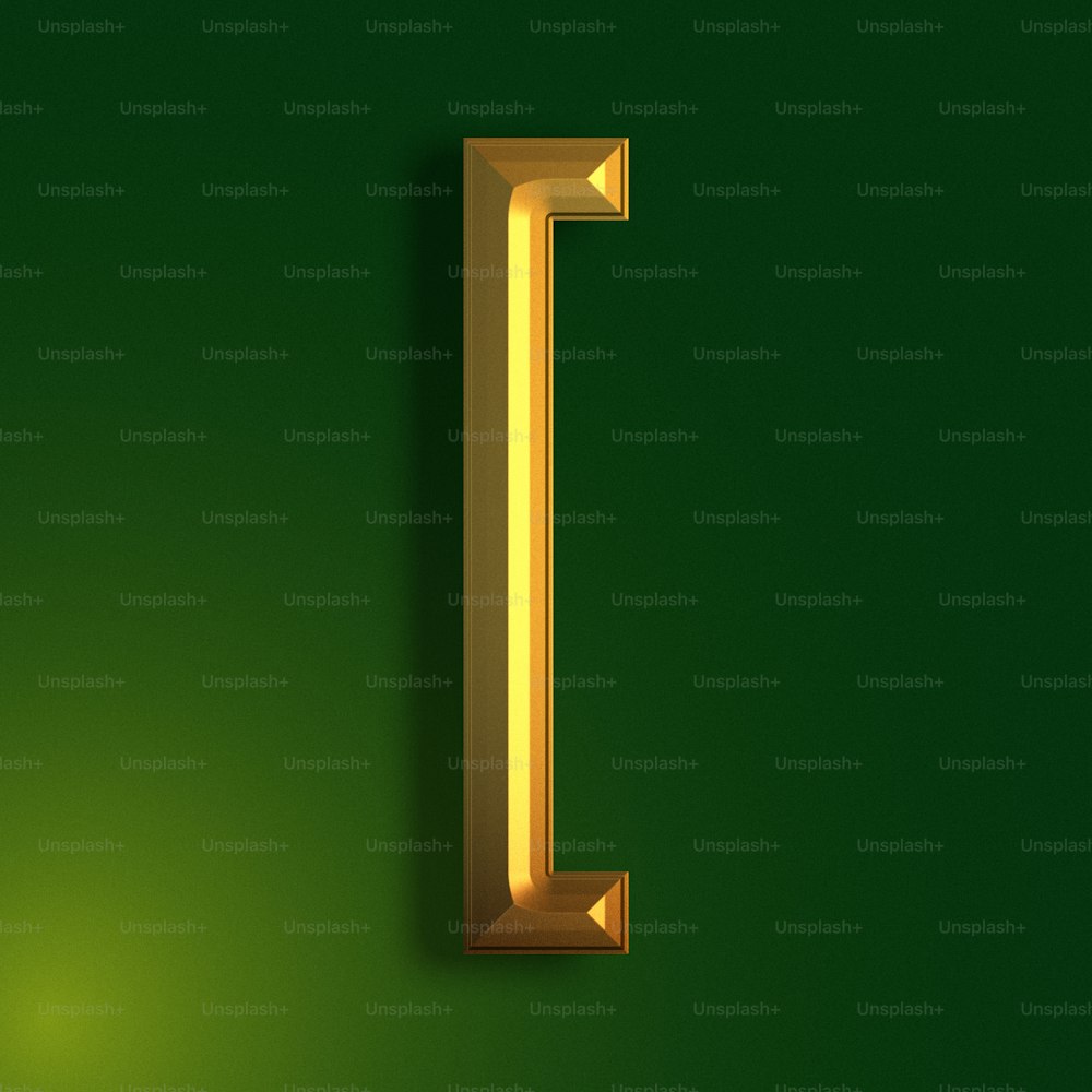 a gold letter l on a green background