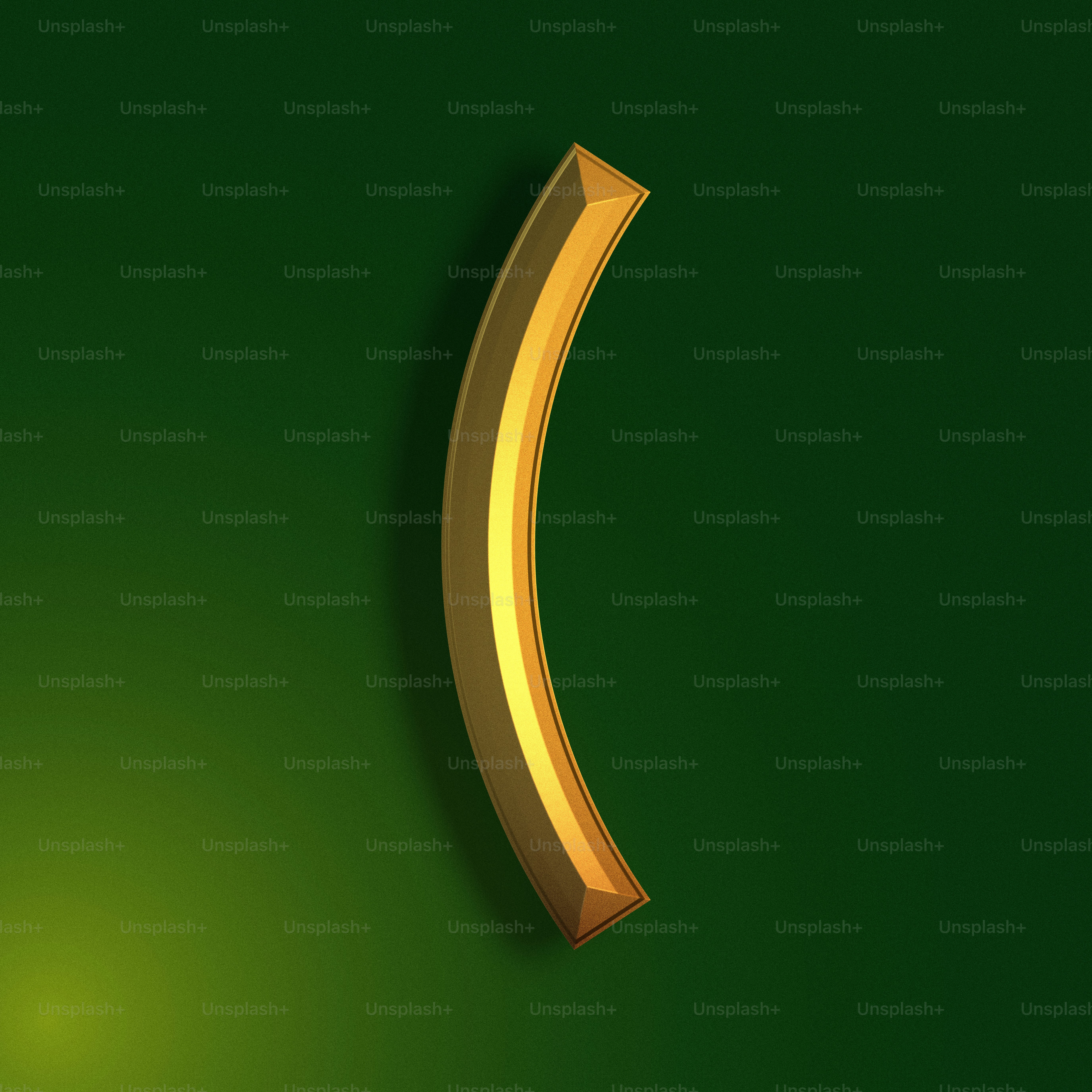 a gold curved object on a green background