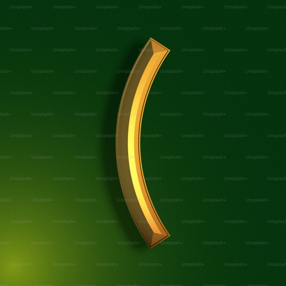 a gold curved object on a green background