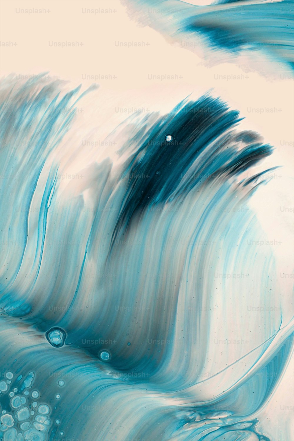 a painting of a wave in blue and white