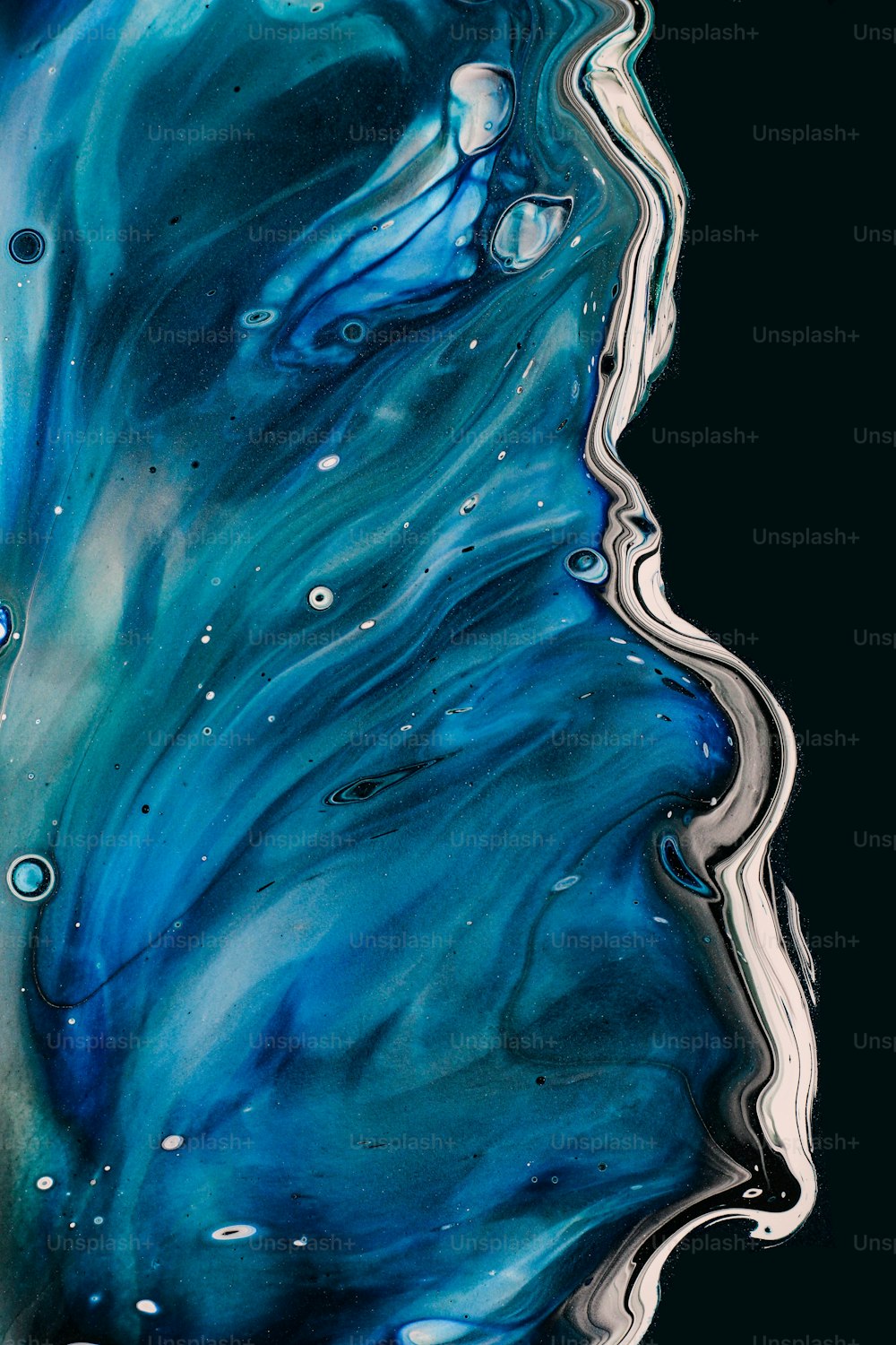 an abstract painting of blue and white liquid