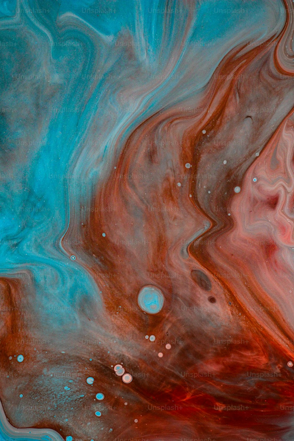 a close up of a red and blue liquid