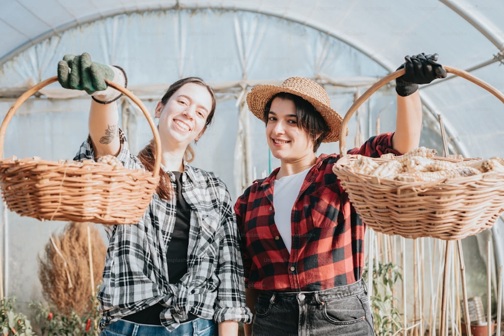 a couple of women standing next to each other holding baskets