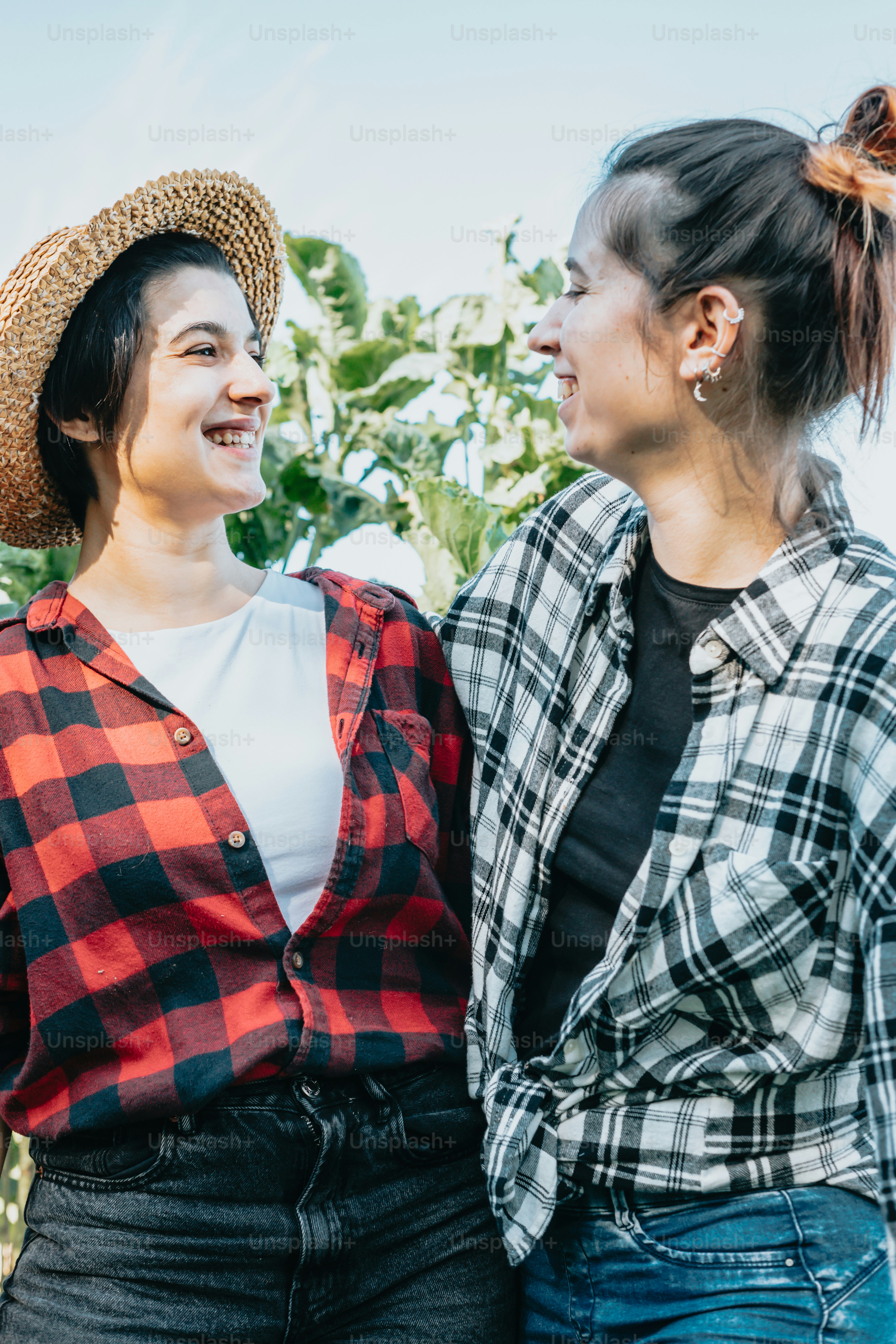 Two young women standing next to each other photo – Vegetarian Image on ...
