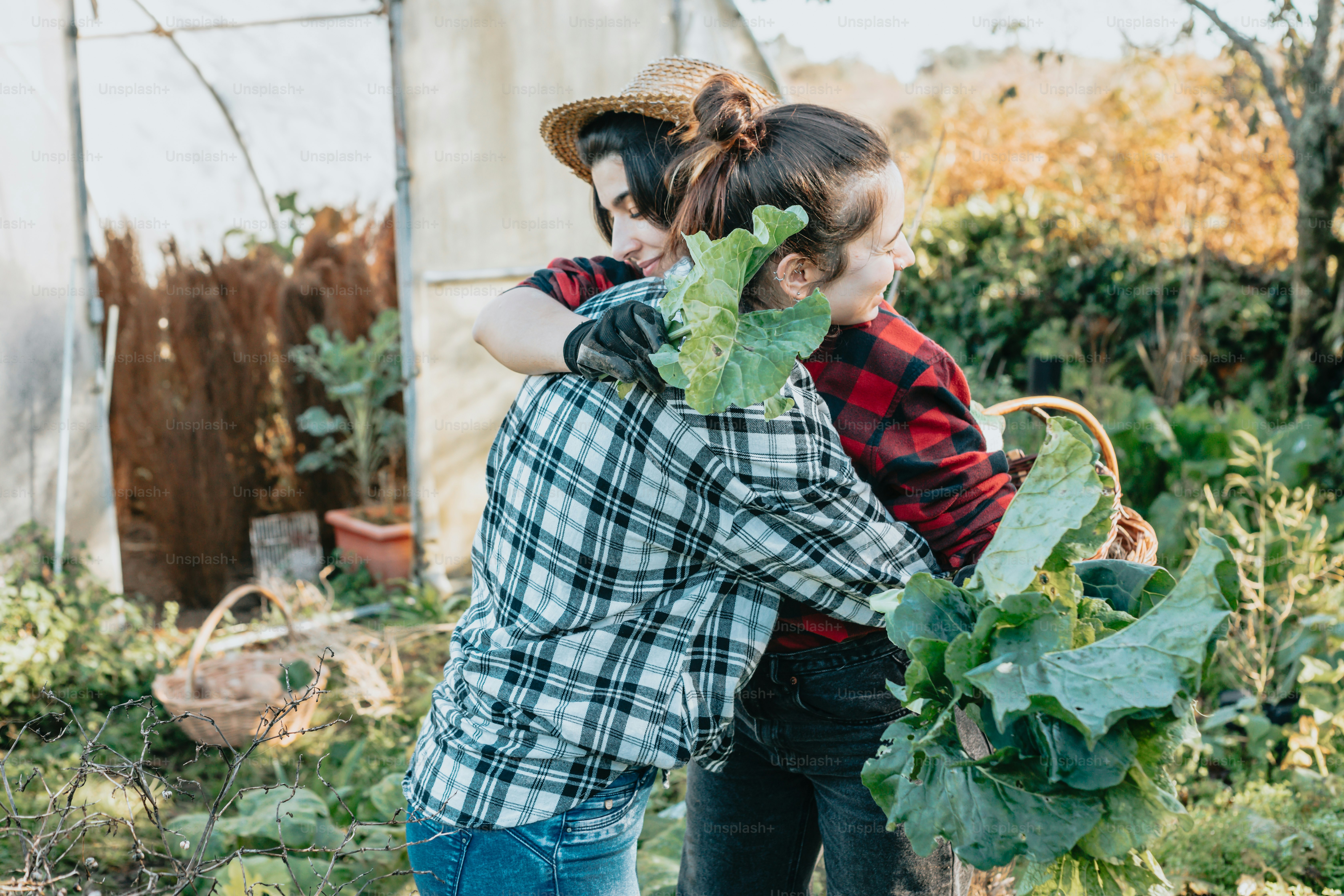 a couple of people that are standing in the grass