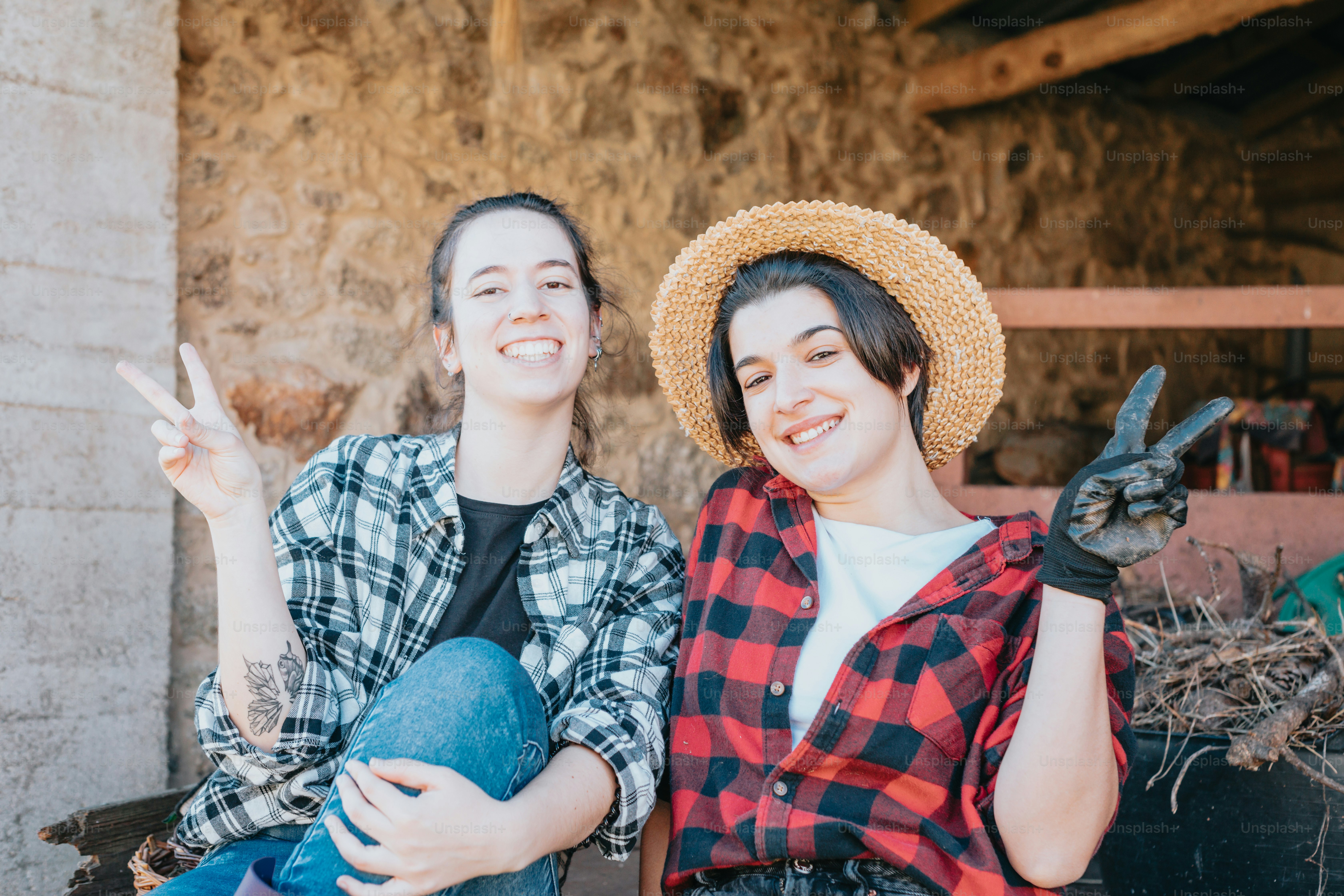 a couple of women sitting next to each other