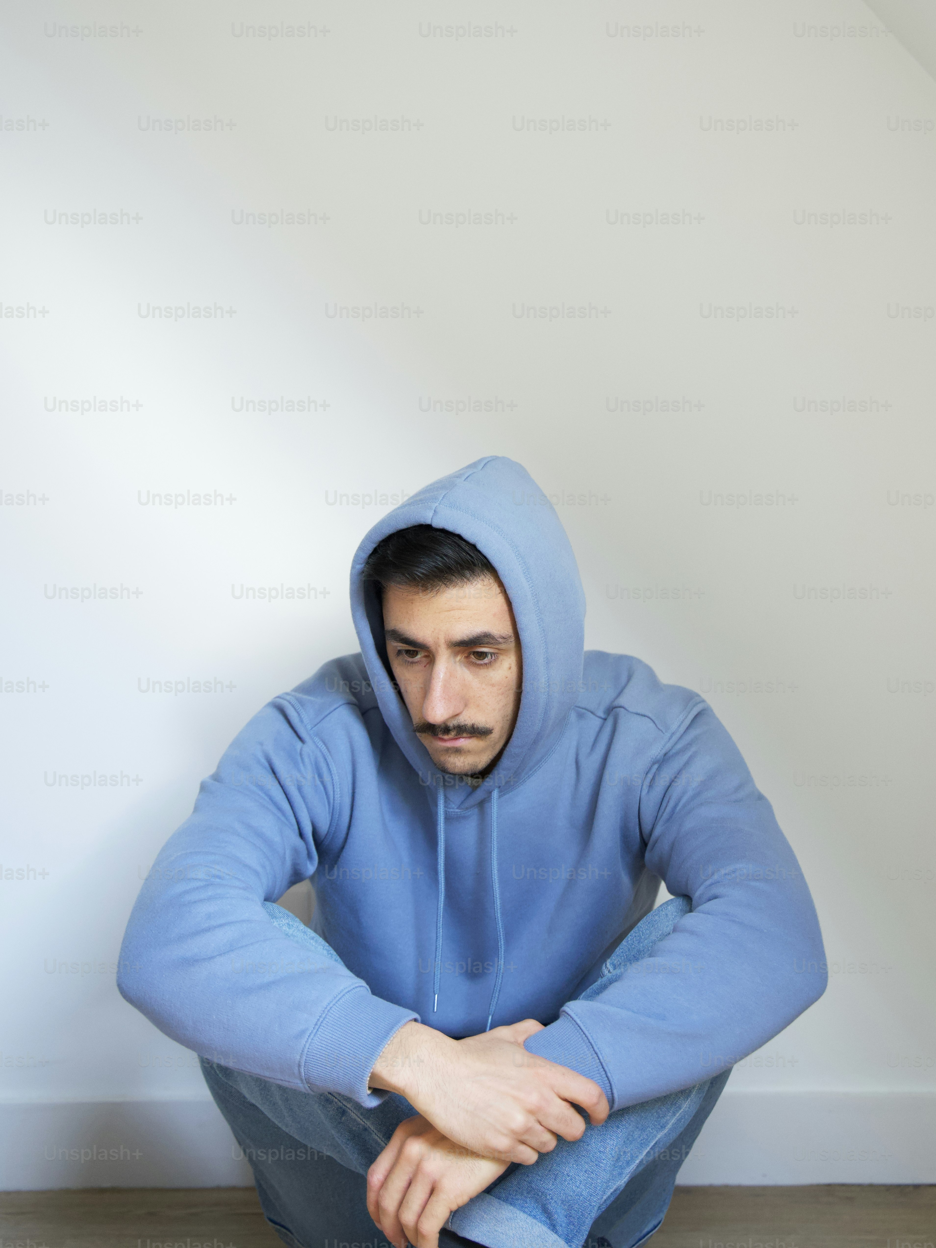 a person in a blue hoodie