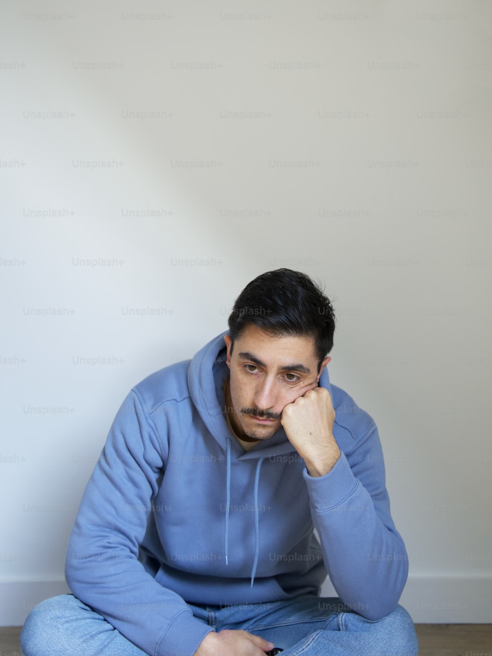 a man sitting on the floor