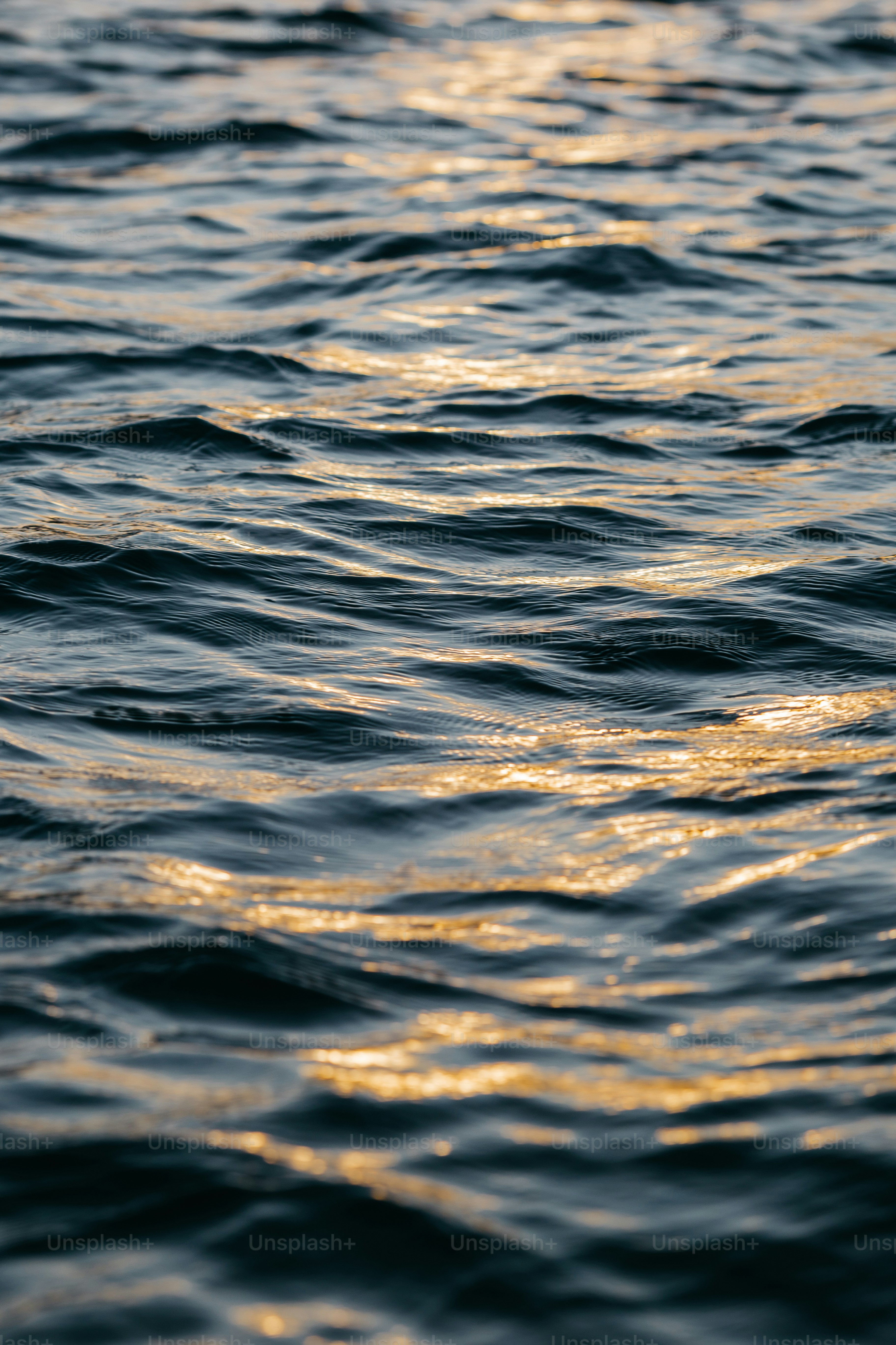 a close up of a body of water with waves