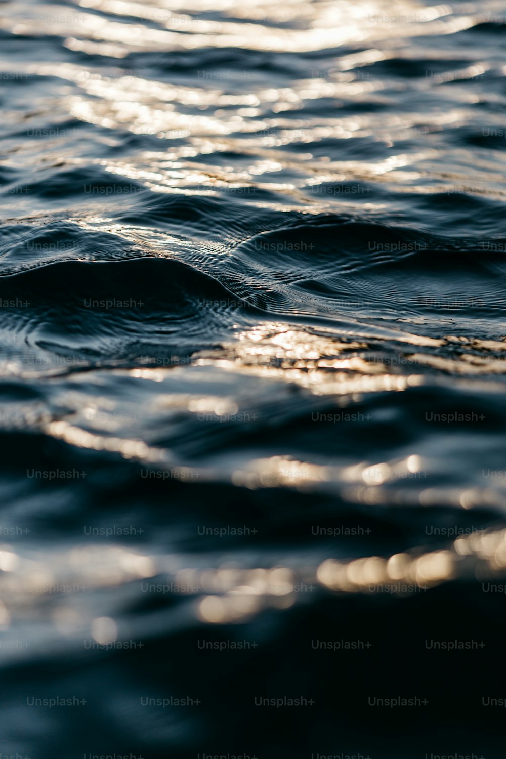 a close up of a body of water with waves