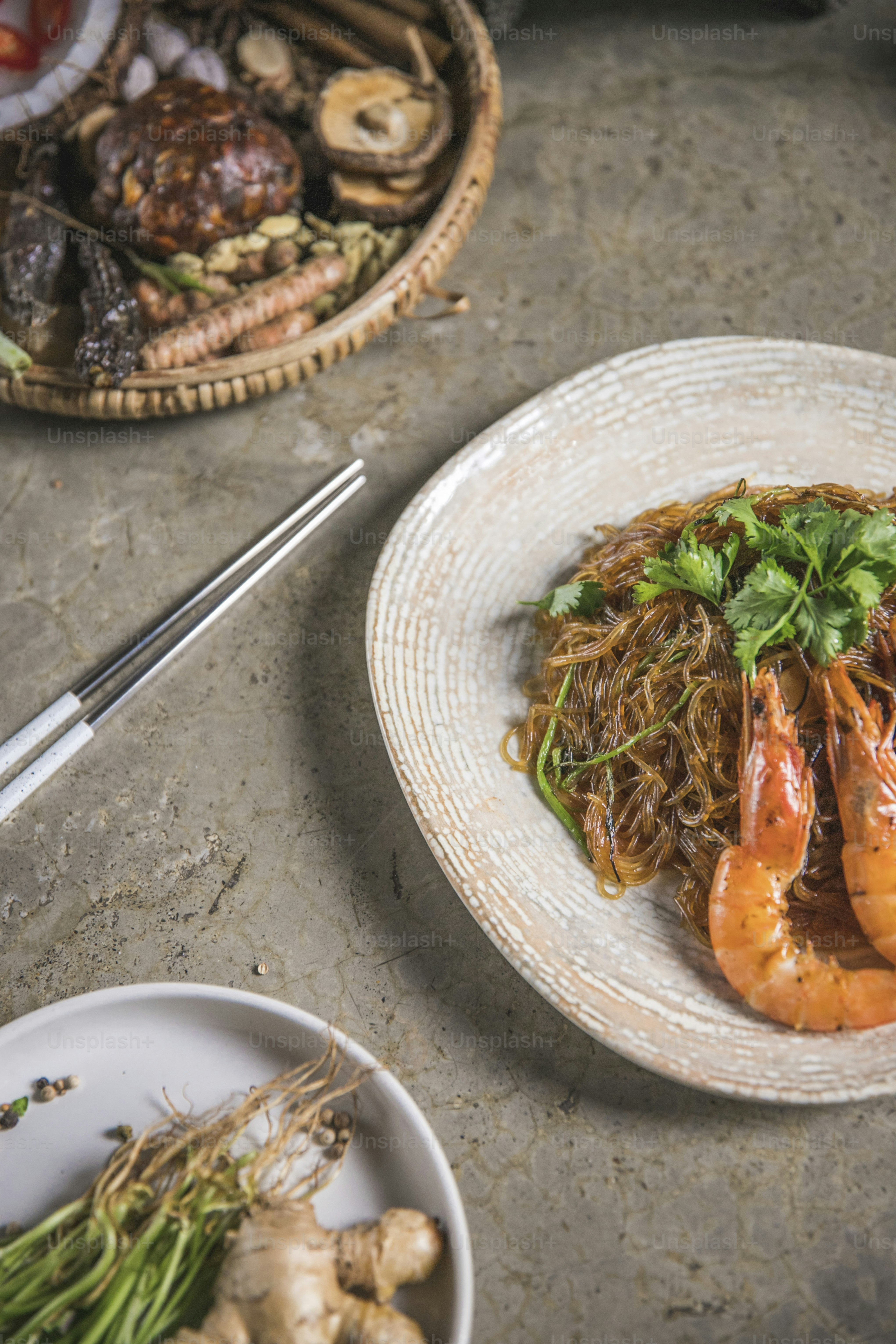 a plate of food with shrimp and noodles