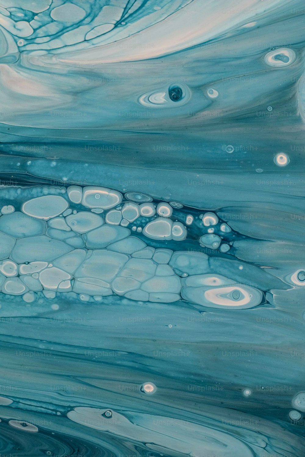 a painting of blue and white water with bubbles