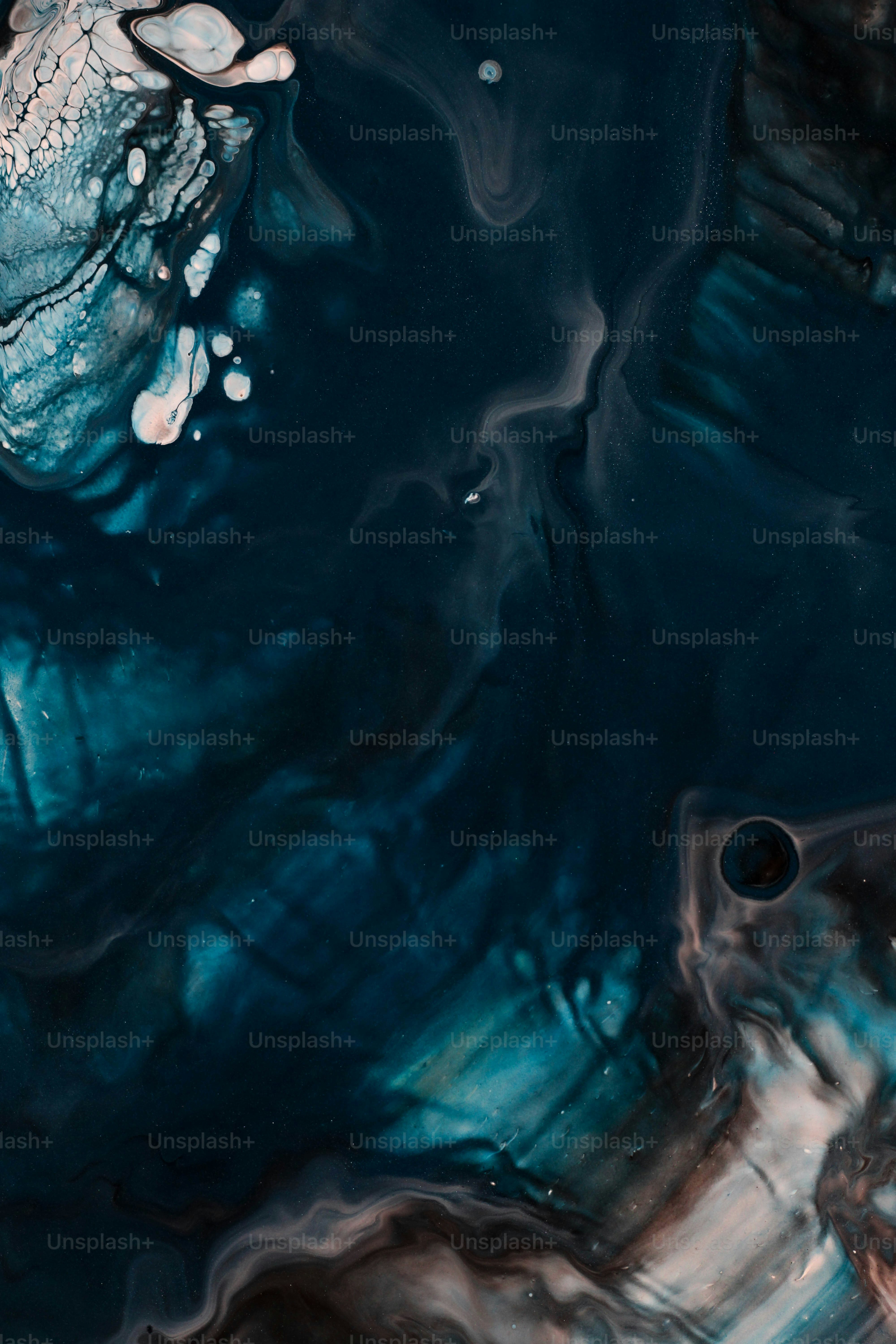 a close up of a blue and black substance