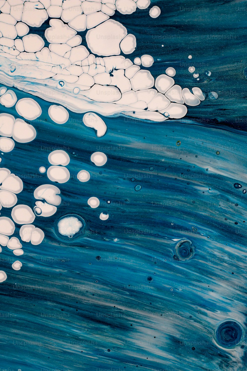 a painting of bubbles floating in the water