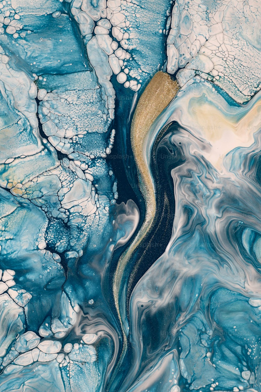an aerial view of a river flowing through ice