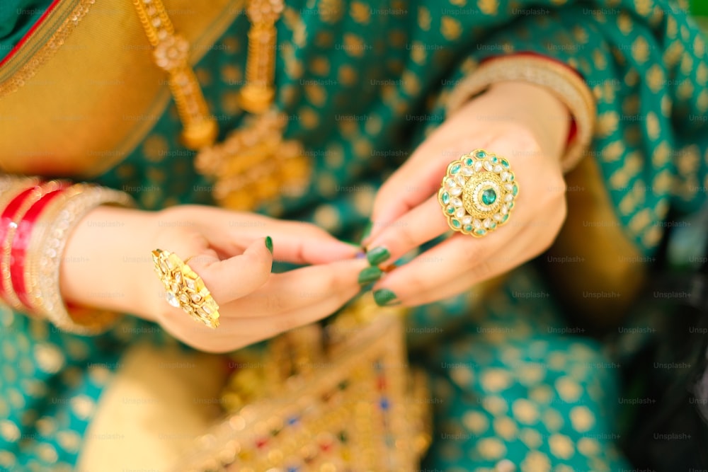 a close up of a person holding a ring