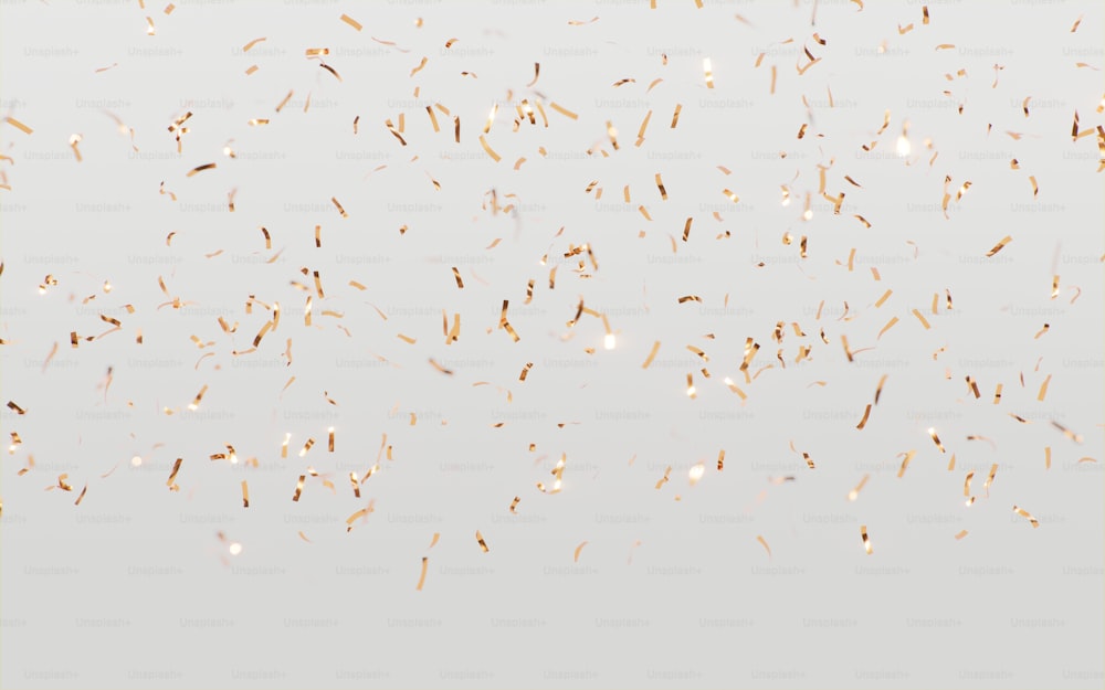 a lot of gold confetti on a white background