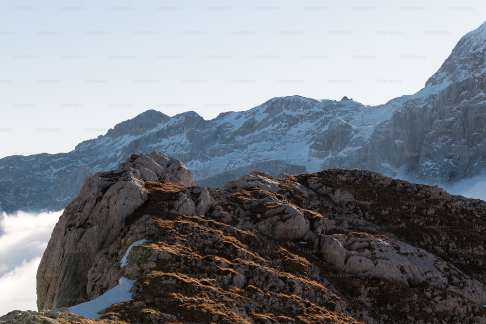 a person standing on the top of a mountain