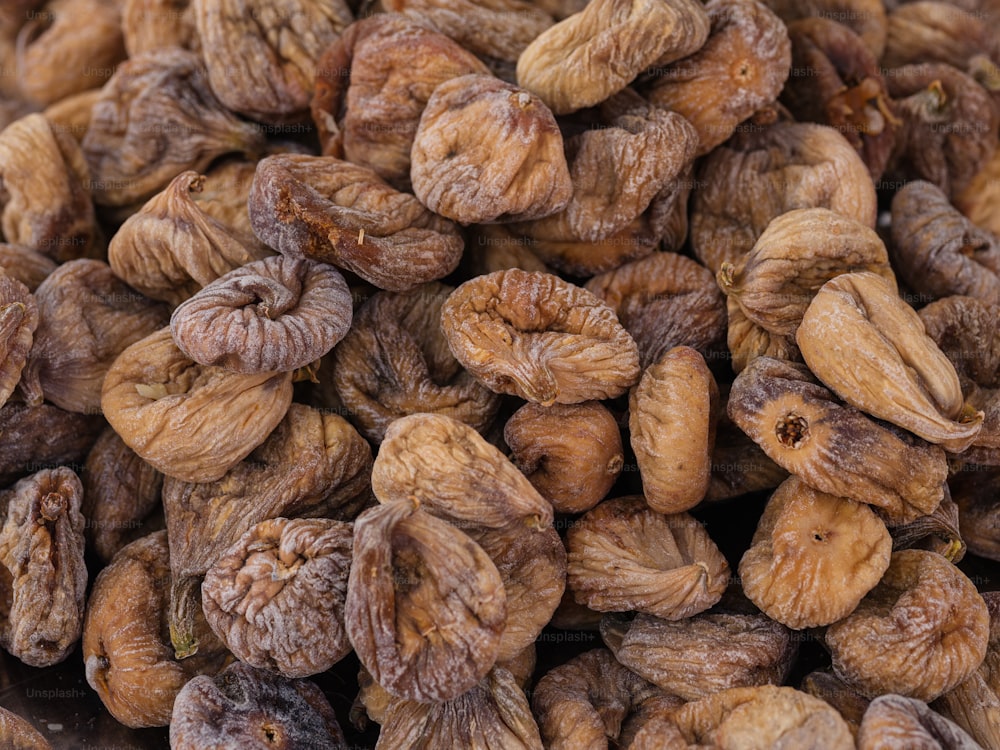 a pile of walnuts sitting next to each other