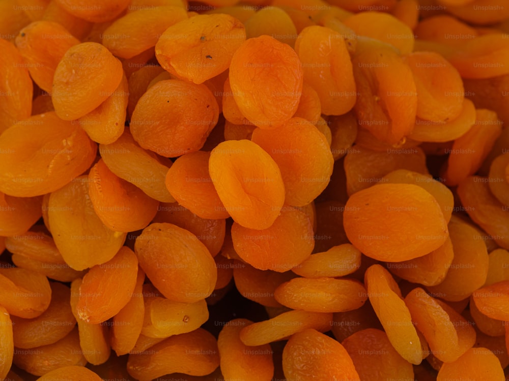 a pile of peeled carrots sitting next to each other