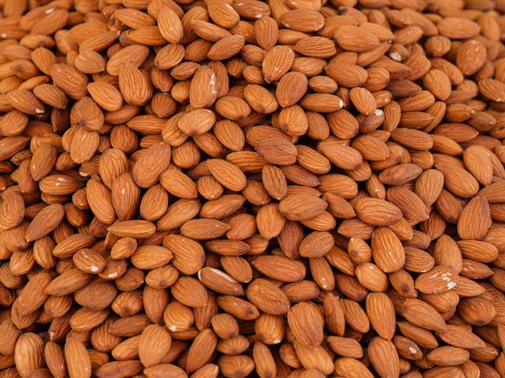 a pile of almonds sitting next to each other