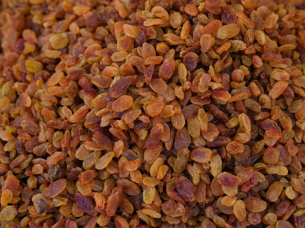 a pile of raisins sitting on top of a table