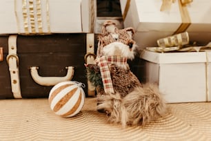 a stuffed animal sitting next to a christmas ornament