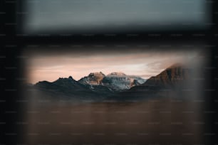 a view of a mountain range through a window