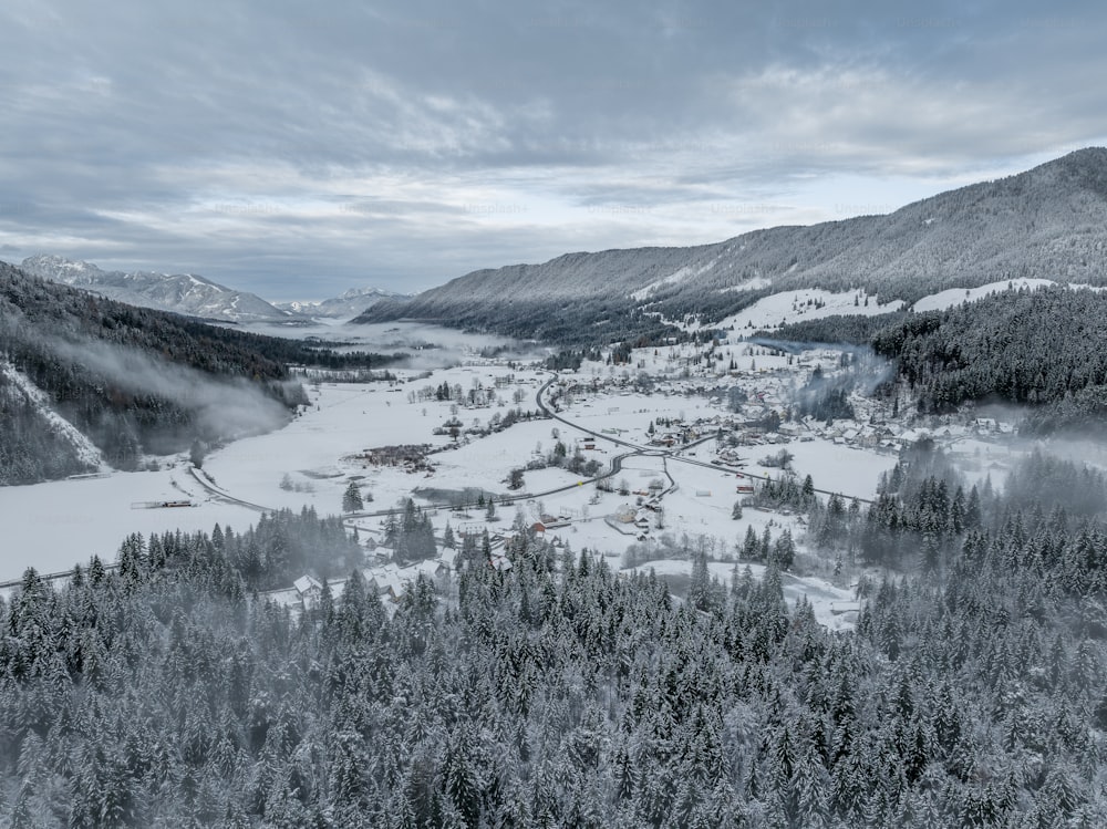an aerial view of a snowy mountain town