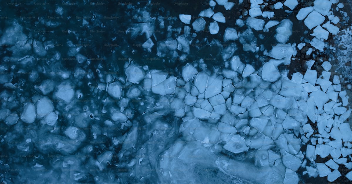 An aerial view of ice and water photo – Ice water Image on Unsplash
